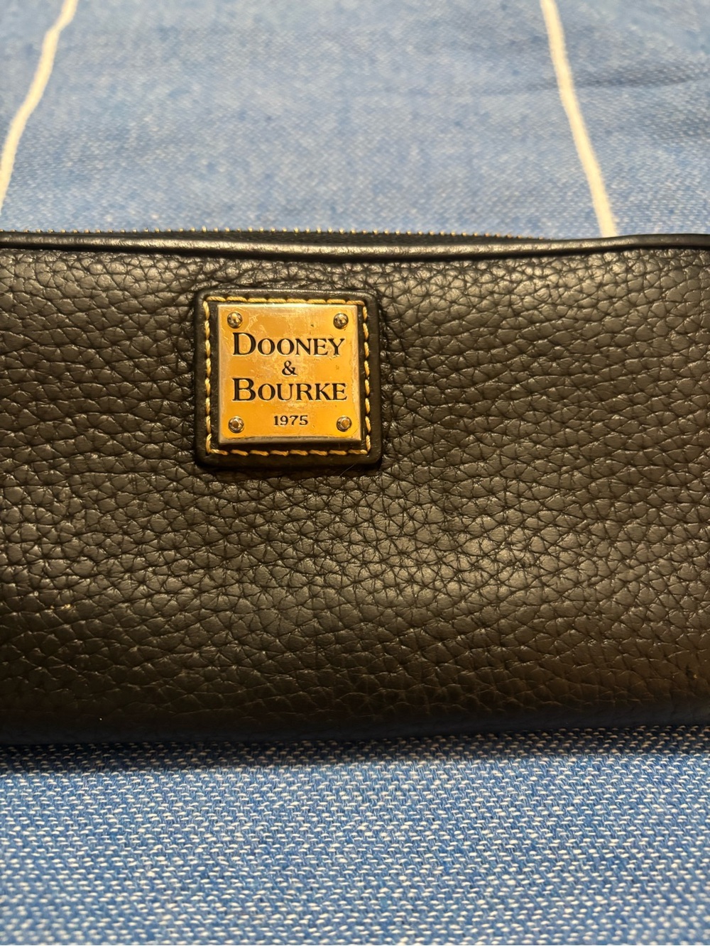 Dooney & Bourke Black Pebbled Leather Wallet with Gold Logo Plaque